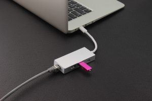 Purple Flash Drive Near Laptop Computer